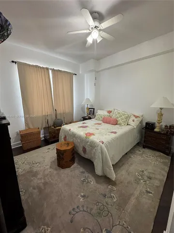 a view of a dining room with furniture a chandelier and wooden floor