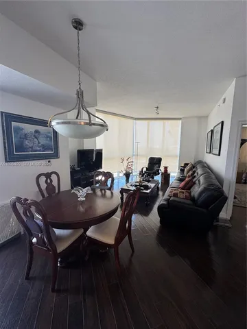 a kitchen with sink refrigerator and cabinets