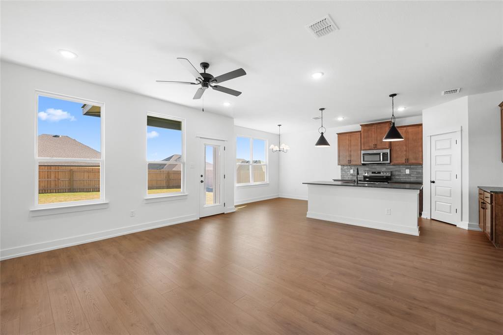 3000 Teasdale Road Lorena, TX 76655 - Photo 2 of 16 a view of an empty room with kitchen and window