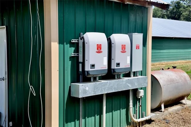 a view of a patio with a table and chairs
