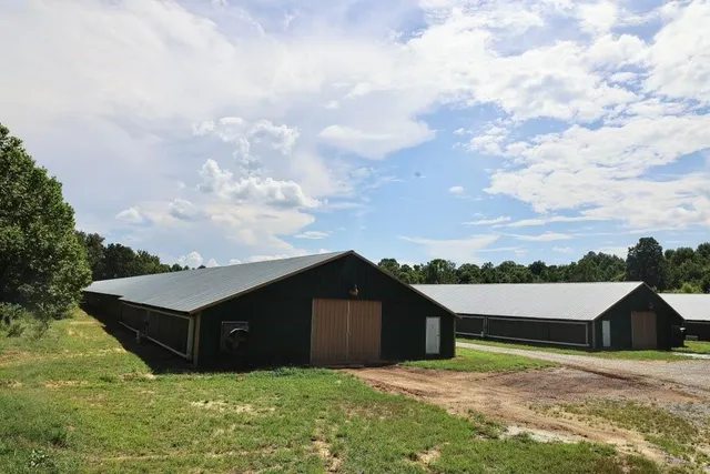 a view of house with yard and entertaining space