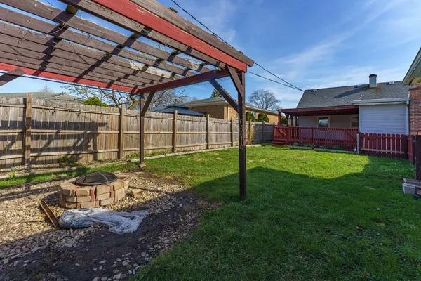 a view of backyard with garage