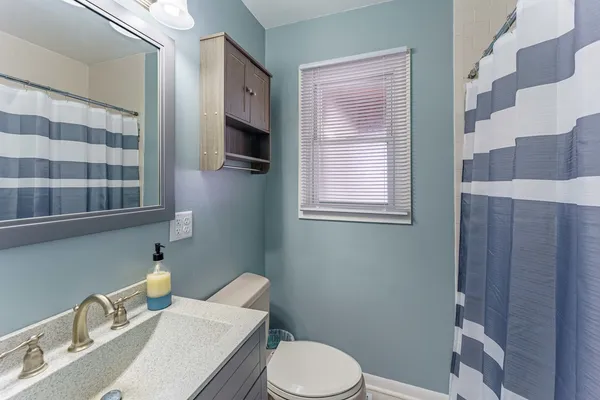 a bathroom with a sink a vanity and a mirror