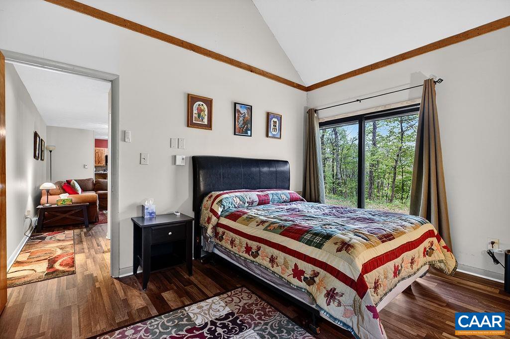 2231 Tanners Ridge Wintergreen, VA 22967 - Photo 19 of 30 a bed sitting in a bedroom next to a window