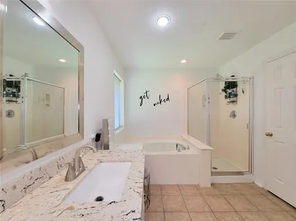 a bathroom with a bathtub sink and toilet