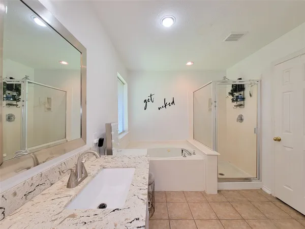 a bathroom with a bathtub sink and toilet