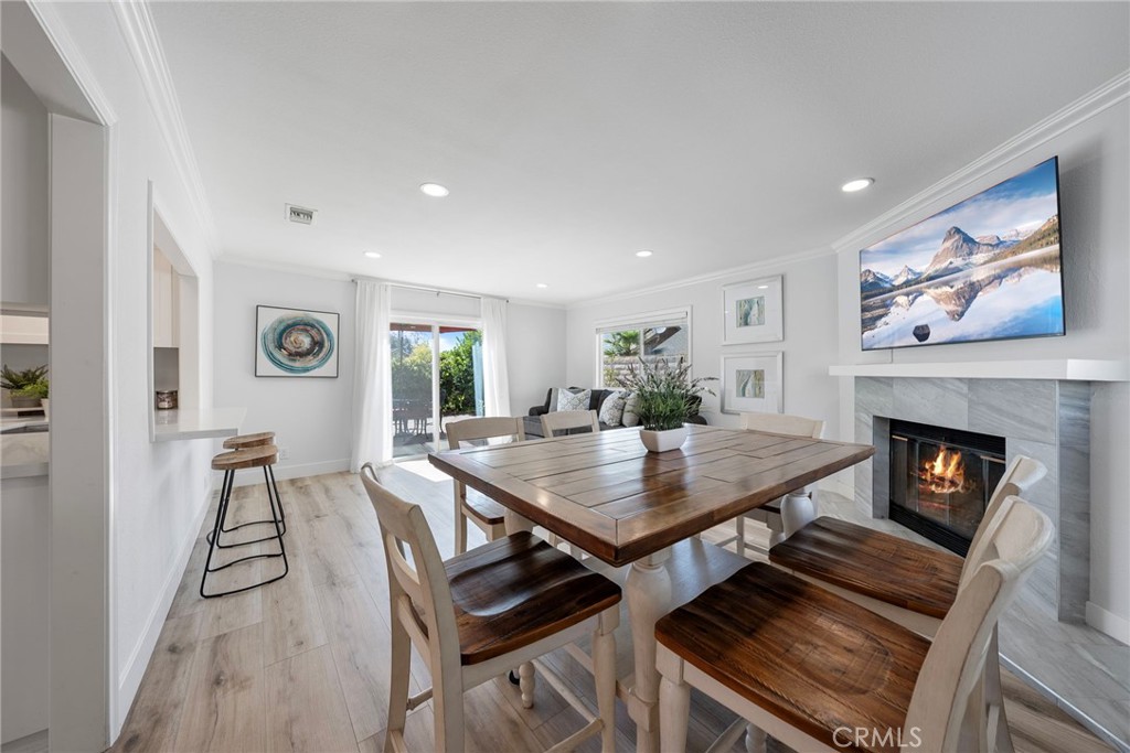22287 Modina Laguna Hills, CA 92653 - Photo 14 of 25 a view of a livingroom with furniture and a fireplace