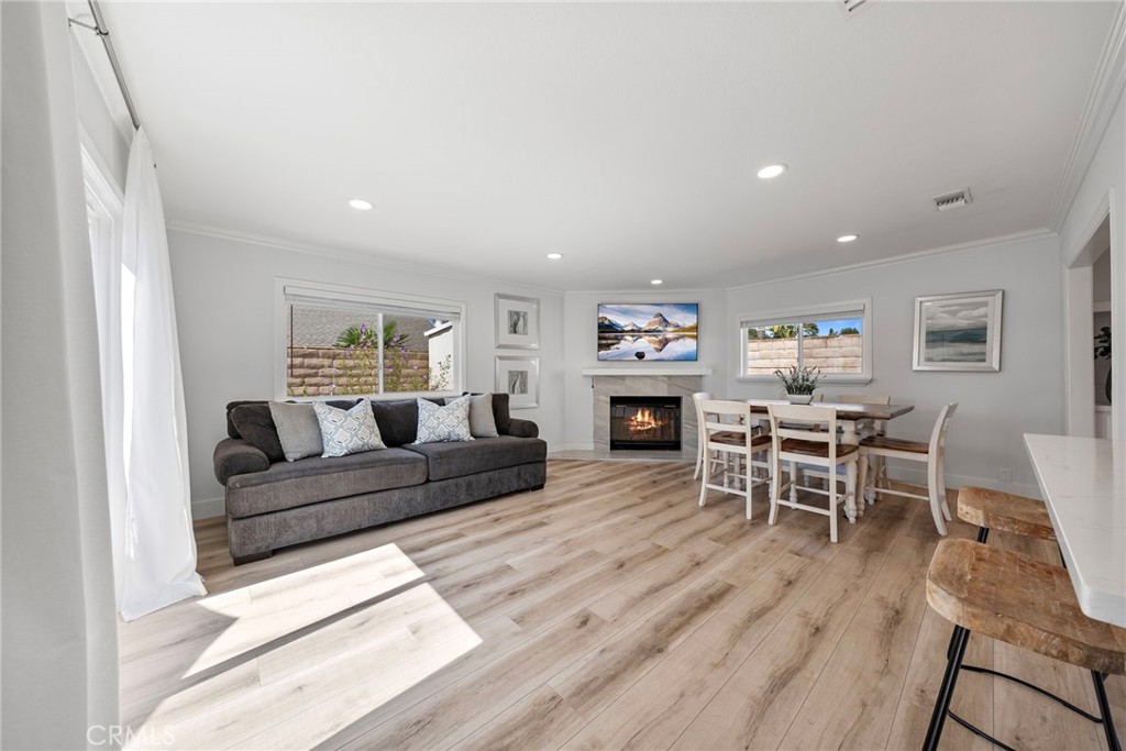 22287 Modina Laguna Hills, CA 92653 - Photo 15 of 25 a living room with furniture and a wooden floor