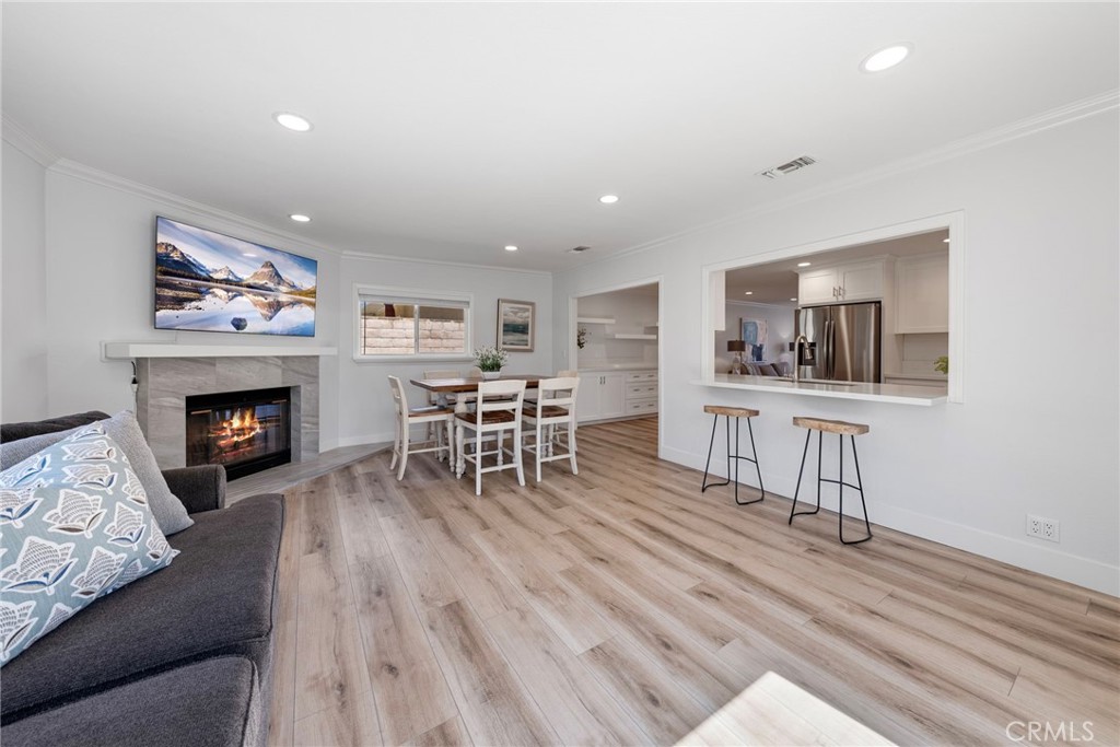 22287 Modina Laguna Hills, CA 92653 - Photo 16 of 25 a living room with furniture and a fireplace