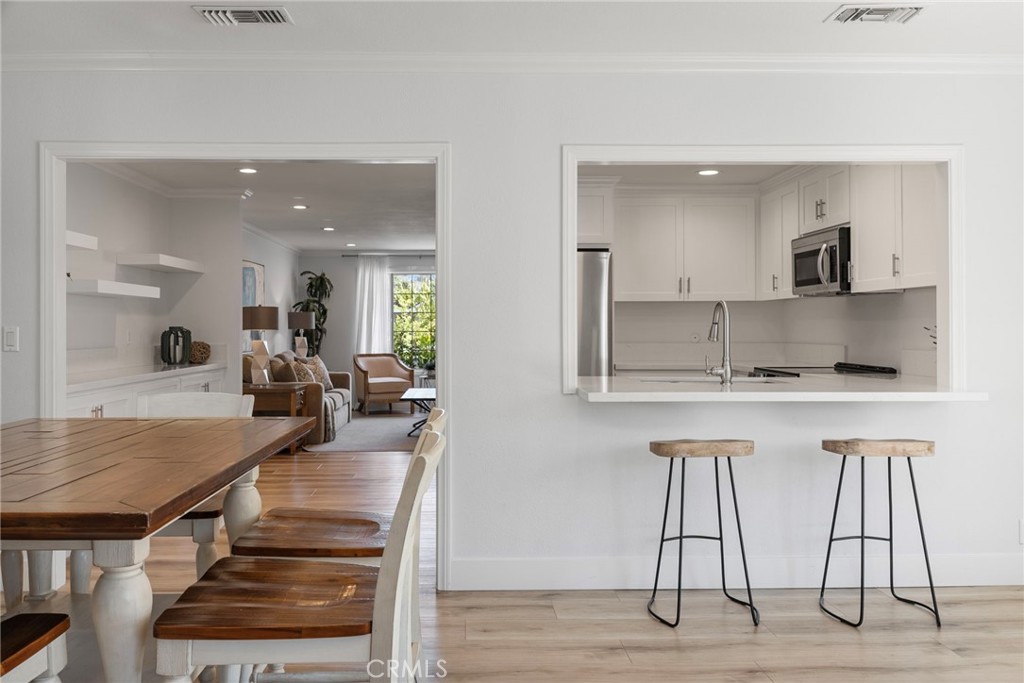 22287 Modina Laguna Hills, CA 92653 - Photo 17 of 25 a living room with furniture and a table