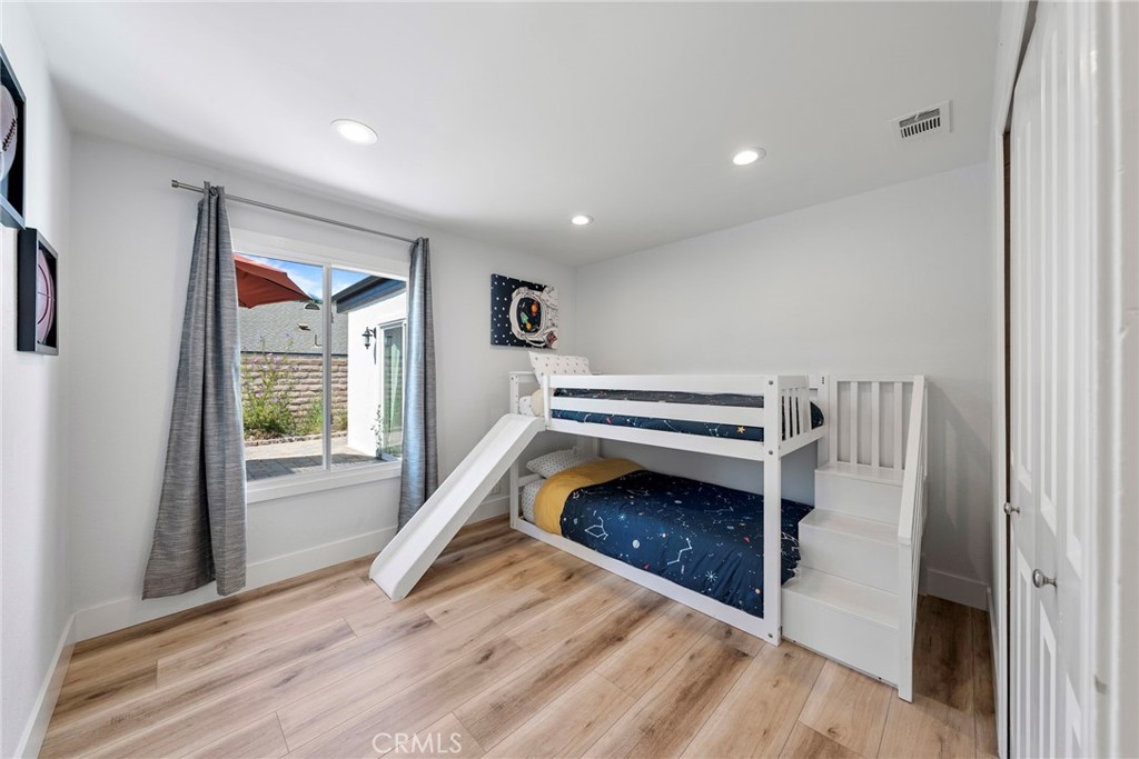 22287 Modina Laguna Hills, CA 92653 - Photo 24 of 25 a view of a livingroom with wooden floor and a fireplace