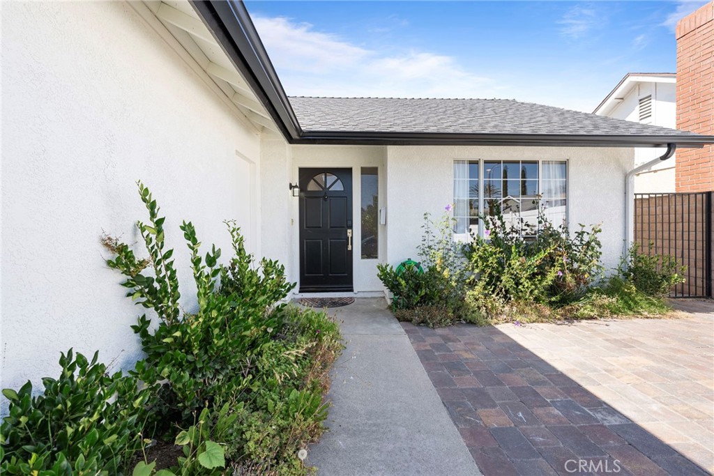 22287 Modina Laguna Hills, CA 92653 - Photo 3 of 25 a front view of a house with a yard