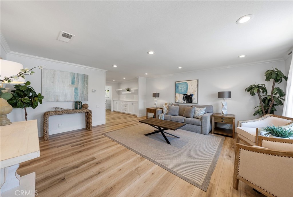 22287 Modina Laguna Hills, CA 92653 - Photo 5 of 25 a living room with furniture and a potted plant