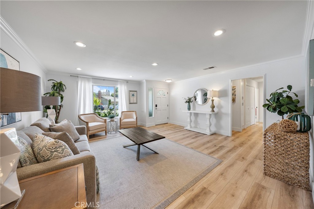 22287 Modina Laguna Hills, CA 92653 - Photo 7 of 25 a living room with furniture and a table