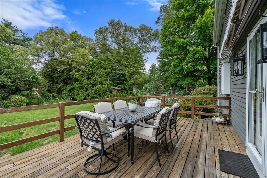 322 Concord Road Wayland, MA 01778 - Photo 13 of 35 a view of a chairs and table on the deck