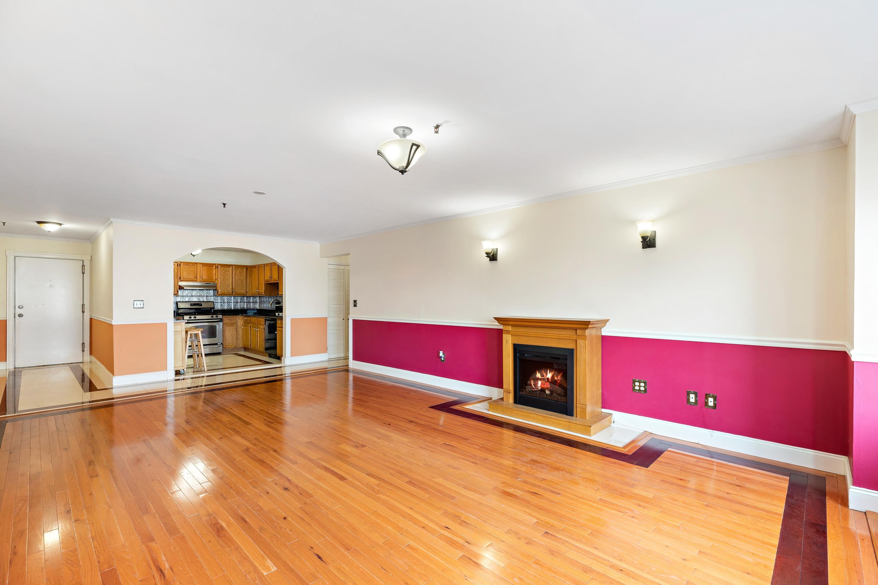 56 Ferguson Street, Unit C2 Newark, NJ 07105 - Photo 2 of 16 a living room with furniture and a wooden floor