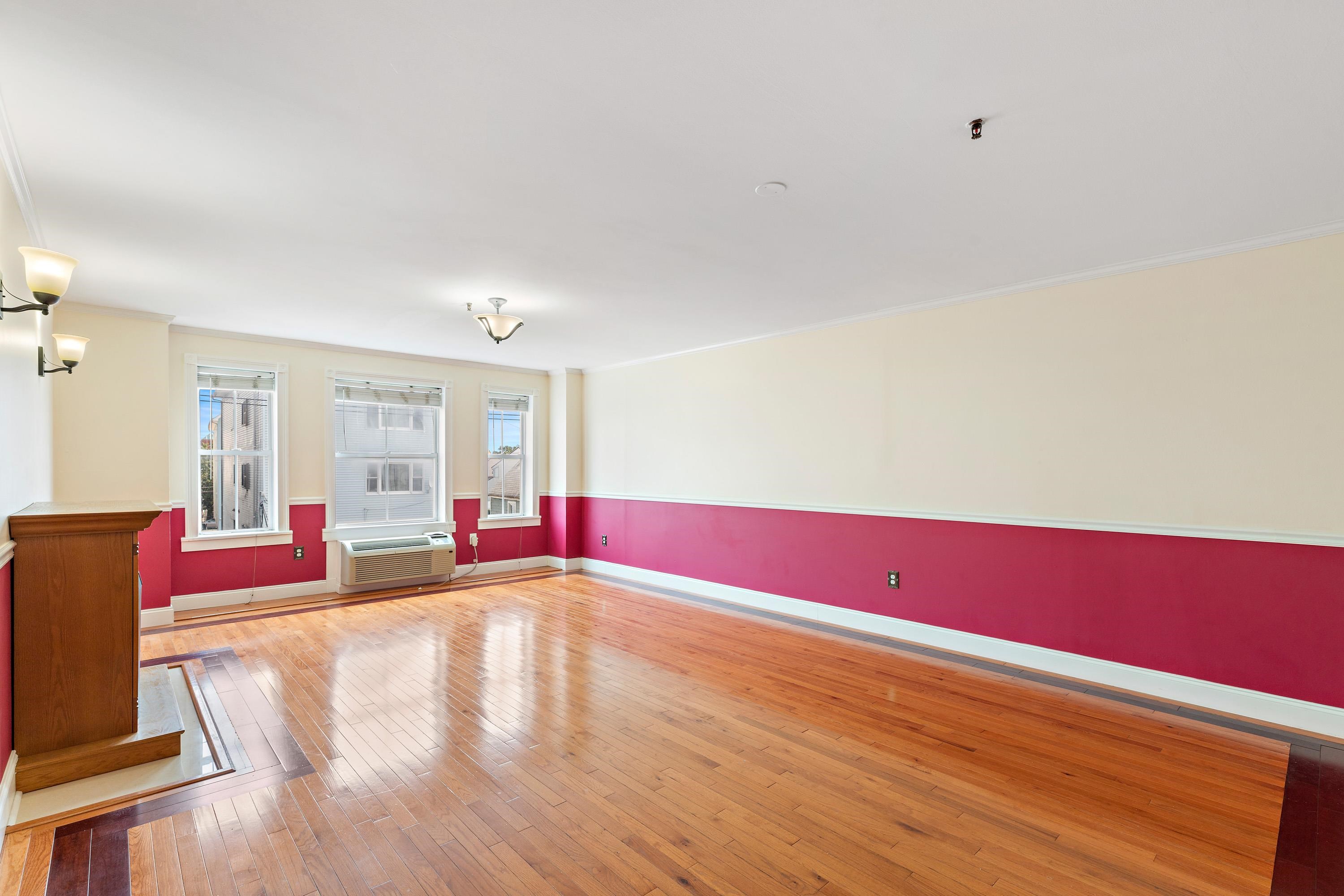 56 Ferguson Street, Unit C2 Newark, NJ 07105 - Photo 7 of 16 a view of empty room with wooden floor