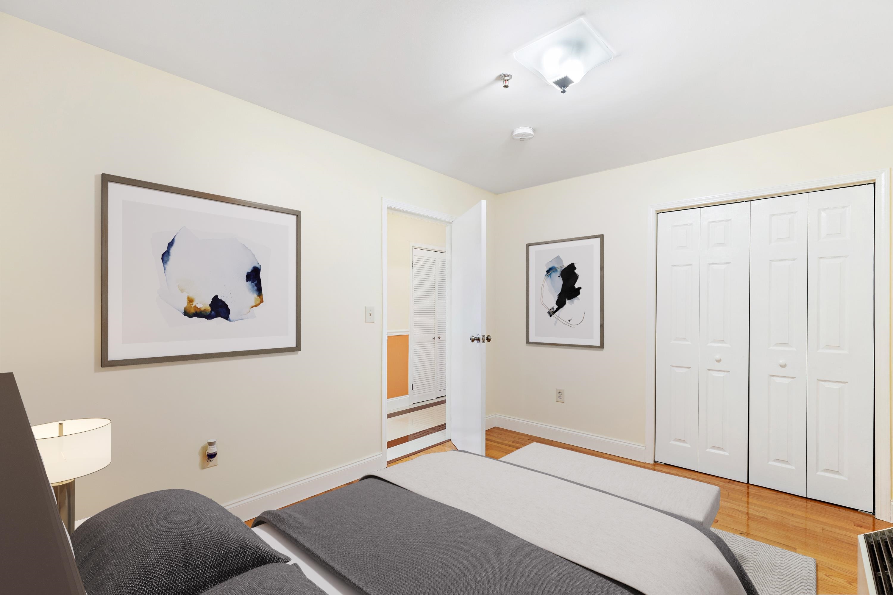 56 Ferguson Street, Unit C2 Newark, NJ 07105 - Photo 9 of 16 a bedroom with a bed and a painting on the wall