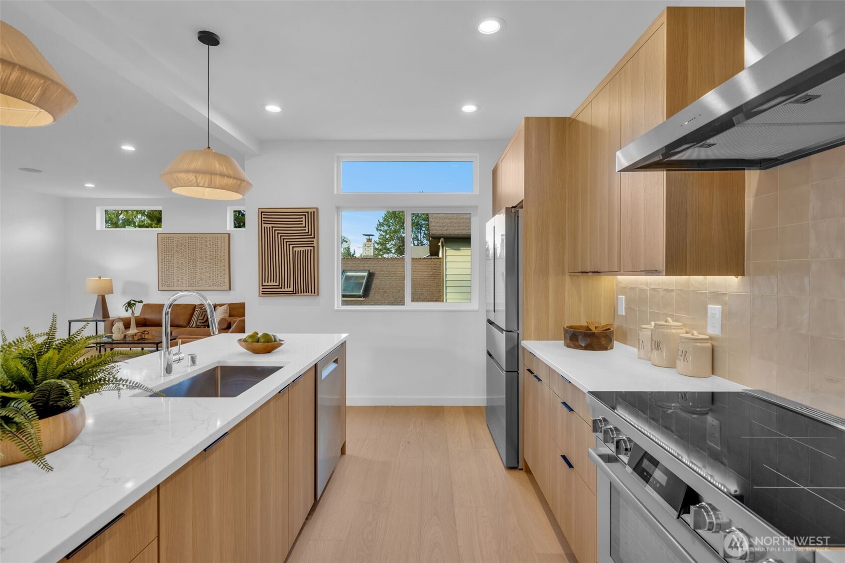 5642 49th Avenue Southwest Seattle, WA 98136 - Photo 12 of 39 a kitchen with counter top space sink and stove