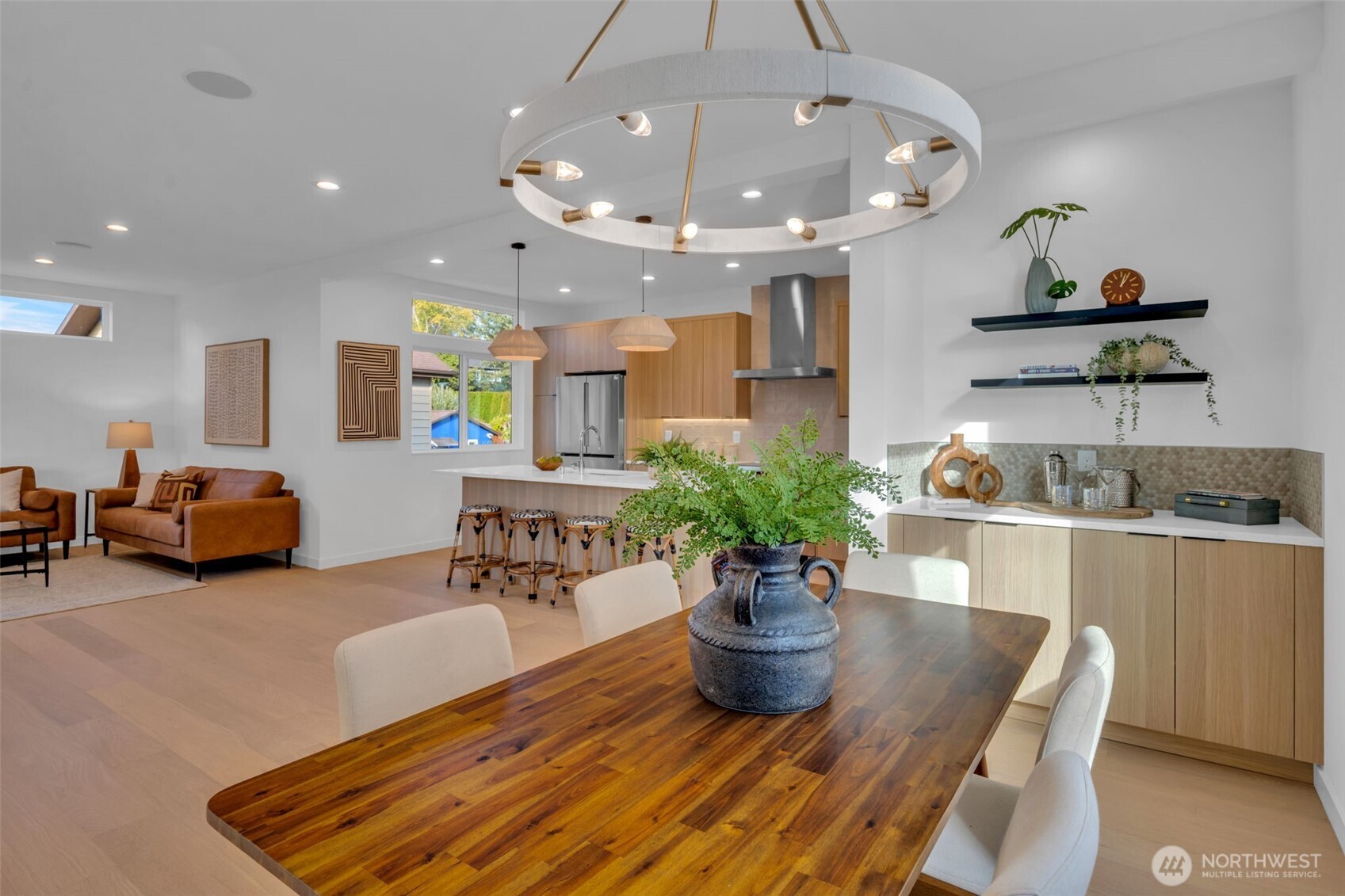 5642 49th Avenue Southwest Seattle, WA 98136 - Photo 16 of 39 a living room with furniture potted plant and kitchen view