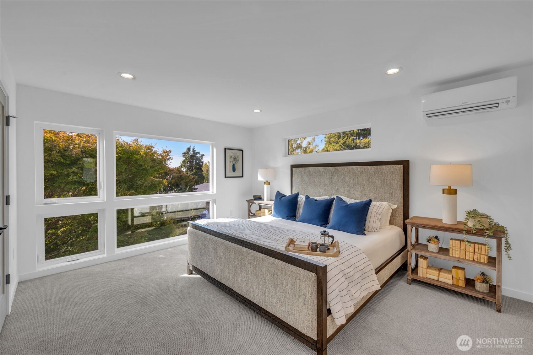 5642 49th Avenue Southwest Seattle, WA 98136 - Photo 27 of 39 a bedroom with a bed and a large window