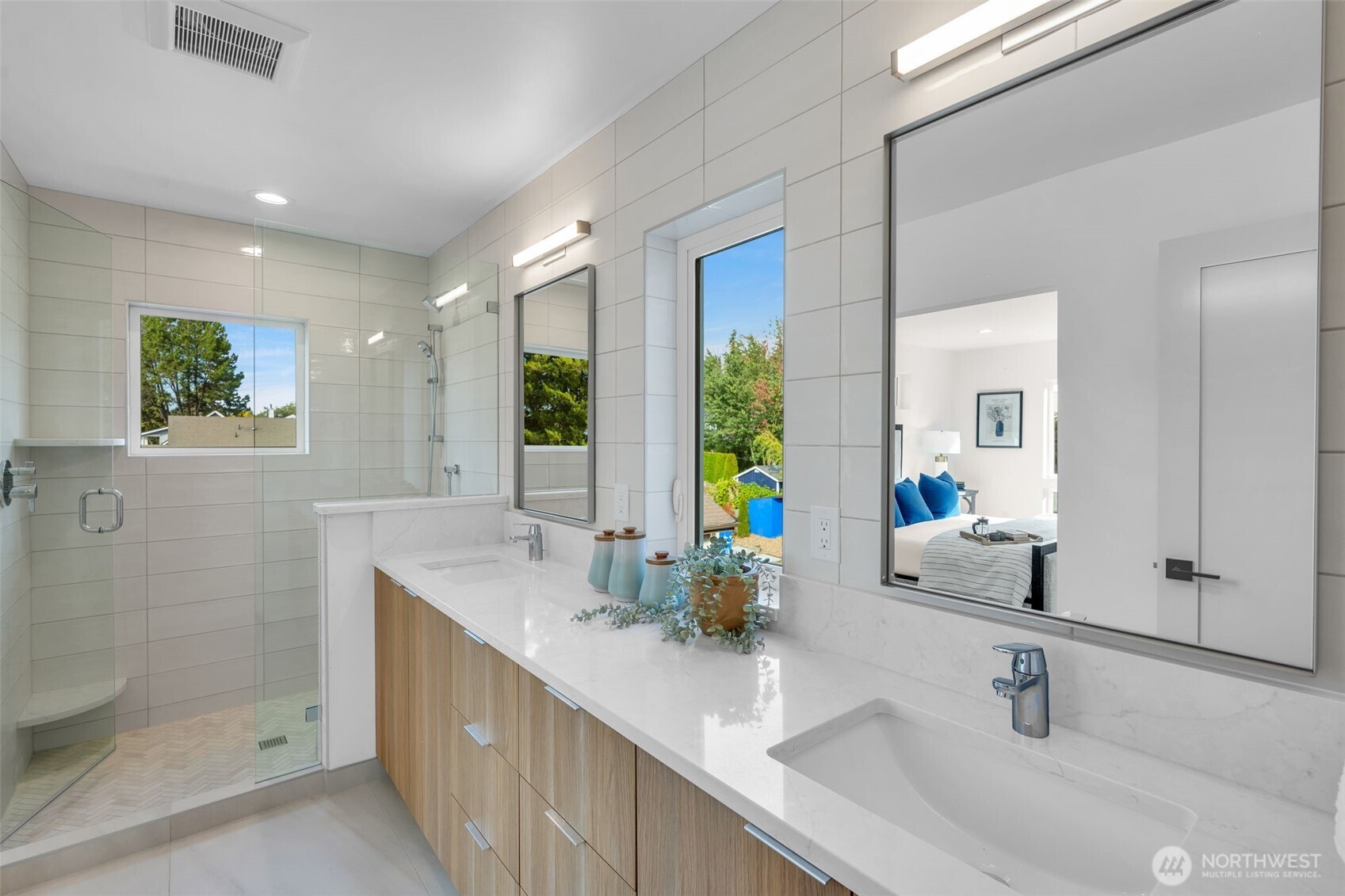 5642 49th Avenue Southwest Seattle, WA 98136 - Photo 32 of 39 a bathroom with double vanity sink and a shower