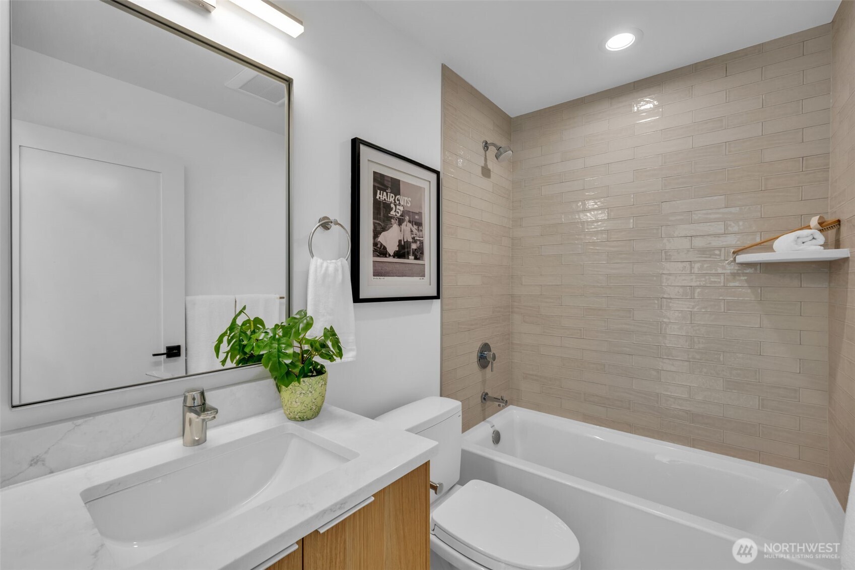 5642 49th Avenue Southwest Seattle, WA 98136 - Photo 35 of 39 a bath room with a toilet a sink and a bath tub