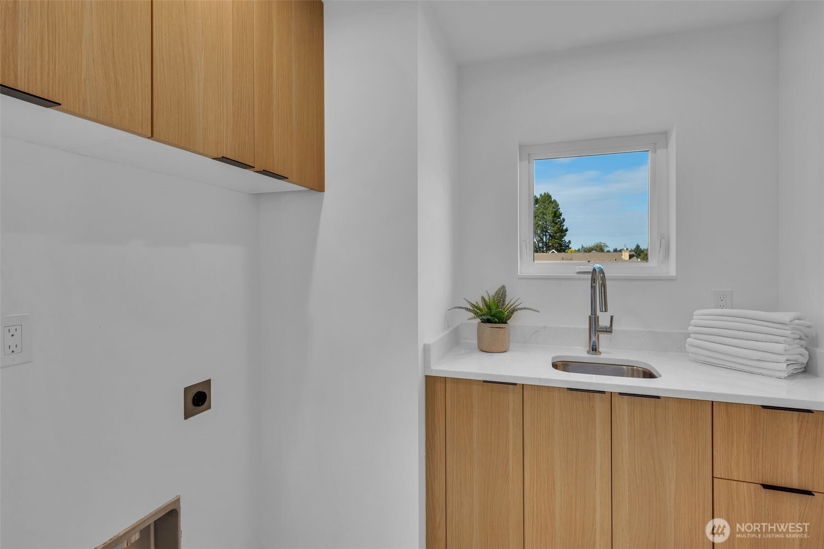 5642 49th Avenue Southwest Seattle, WA 98136 - Photo 36 of 39 a bathroom with a sink and a mirror