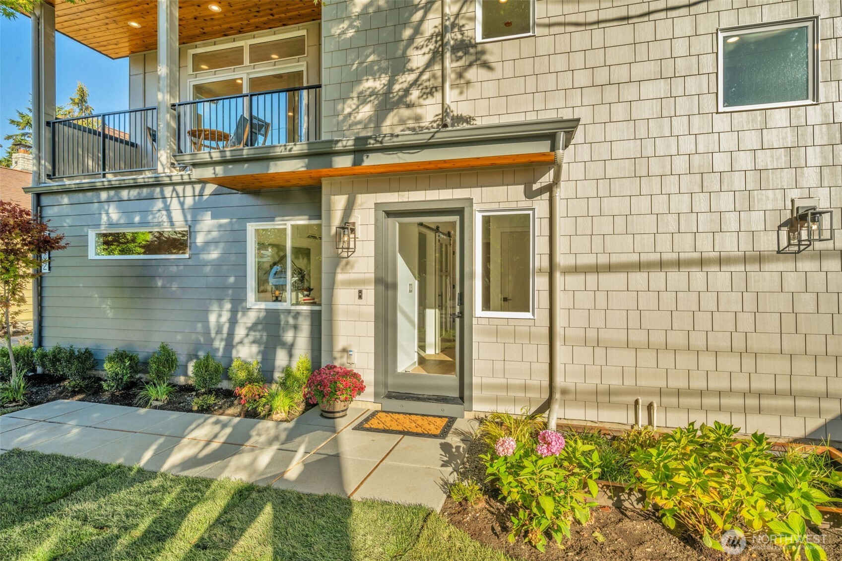 5642 49th Avenue Southwest Seattle, WA 98136 - Photo 37 of 39 a view of a brick building with a bench in front of house