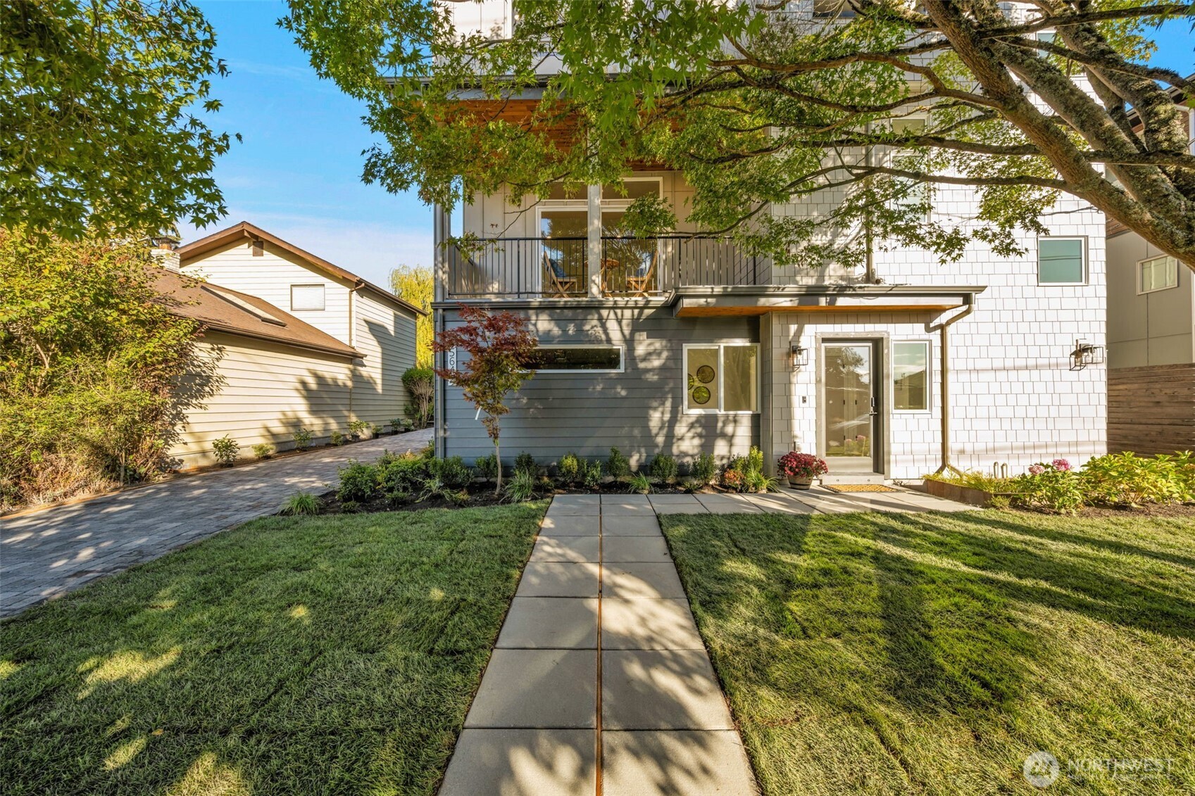5642 49th Avenue Southwest Seattle, WA 98136 - Photo 38 of 39 a front view of a house with a yard