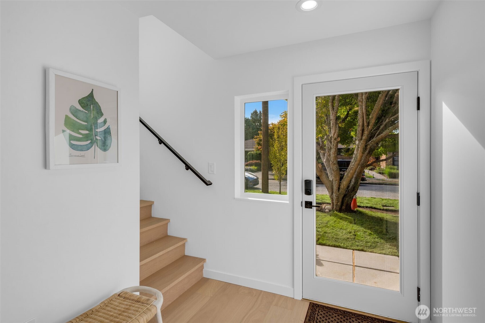 5642 49th Avenue Southwest Seattle, WA 98136 - Photo 4 of 39 a view of entryway with wooden floor and door