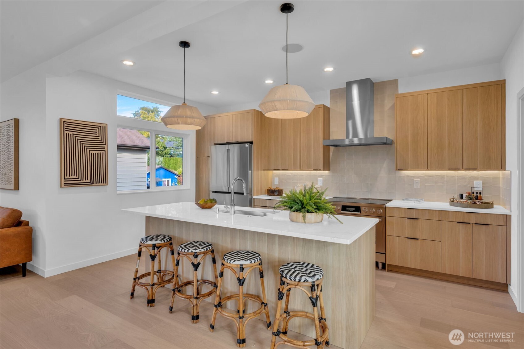5642 49th Avenue Southwest Seattle, WA 98136 - Photo 8 of 39 a kitchen with stainless steel appliances kitchen island granite countertop a sink and a refrigerator