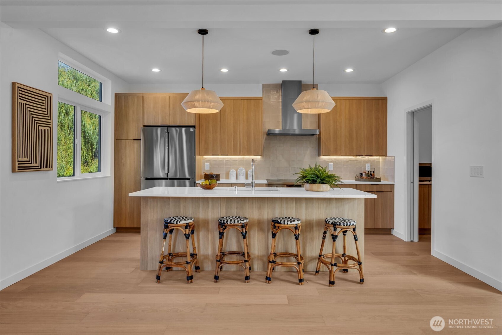 5642 49th Avenue Southwest Seattle, WA 98136 - Photo 9 of 39 a kitchen with a table chairs sink and cabinets