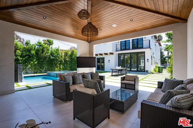 a outdoor space with patio the couches and a dining table with garden view