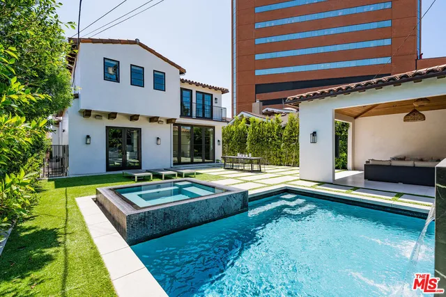 a view of a house with pool table and chairs