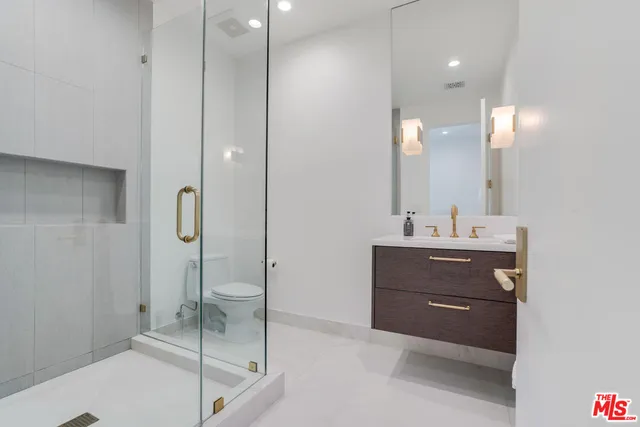 a bathroom with a sink and mirror
