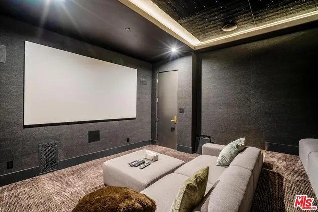 a bedroom with furniture and a projector