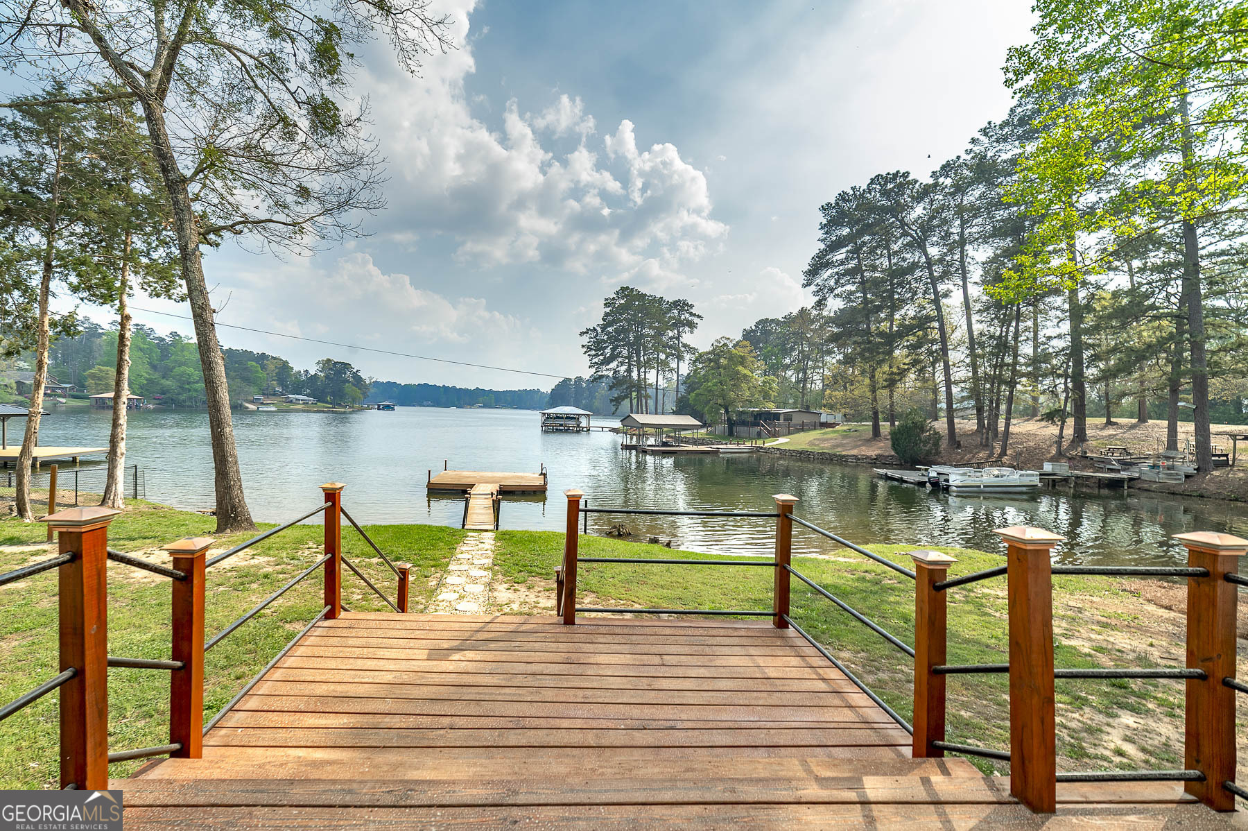 595 Barnetts Bridge Road Jackson, GA 30233 - Photo 8 of 47 a view of a lake with couches and wooden floor