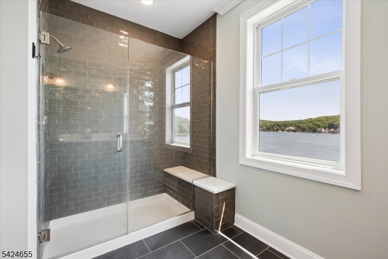 401 Mariners Pointe Hopatcong, NJ 07843 - Photo 29 of 42 a bathroom with a bathtub and a shower