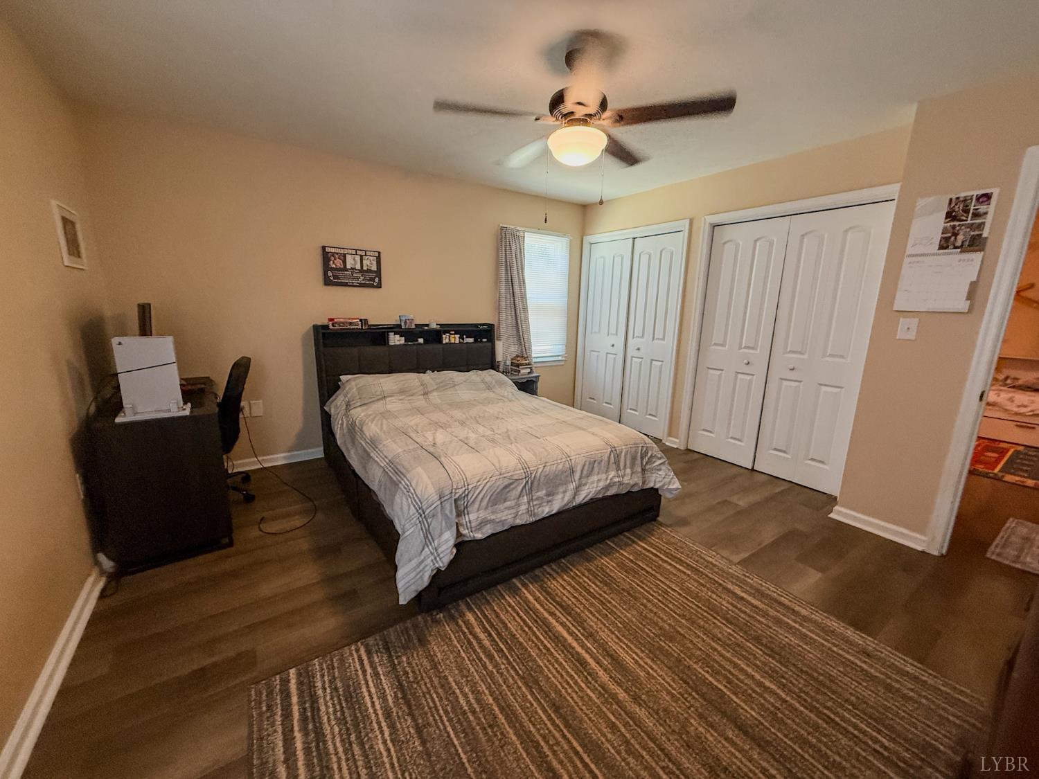 95 Midgett Farm Road Concord, VA 24538 - Photo 14 of 20 a bedroom with a bed and a chandelier