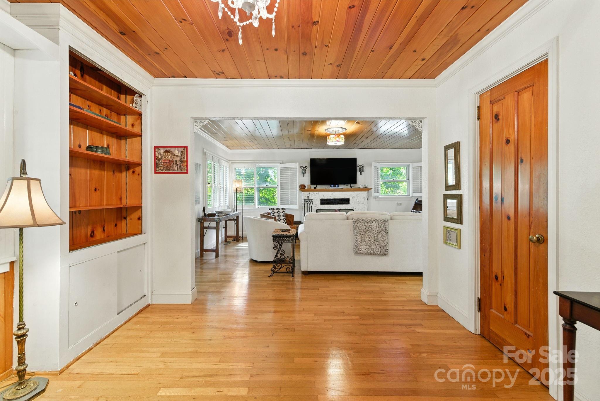 7741 Brevard Road Etowah, NC 28729 - Photo 13 of 48 a living room with furniture and a flat screen tv