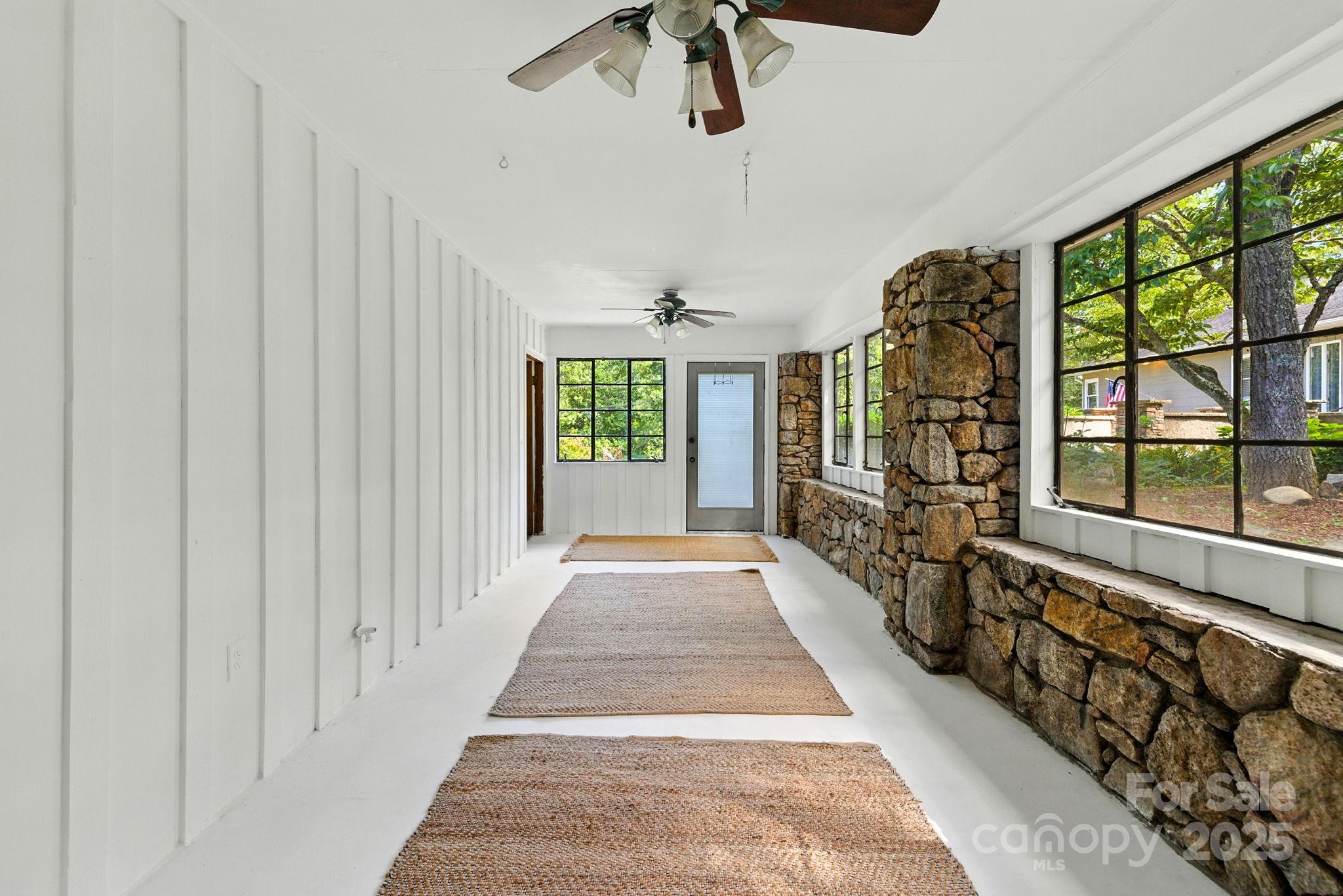 7741 Brevard Road Etowah, NC 28729 - Photo 36 of 48 a view of a hallway with windows