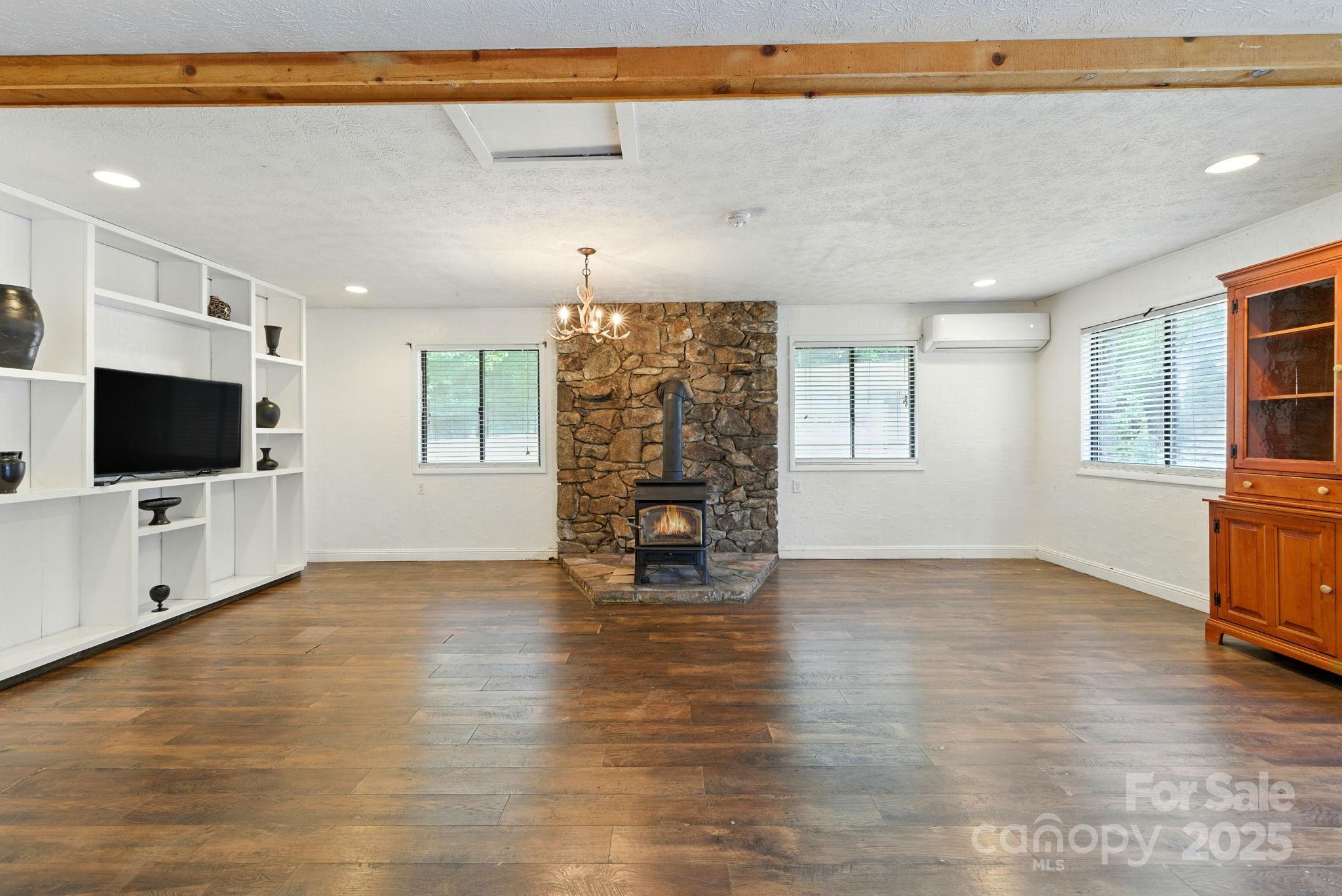 7741 Brevard Road Etowah, NC 28729 - Photo 37 of 48 a view of a livingroom with an empty space and a window