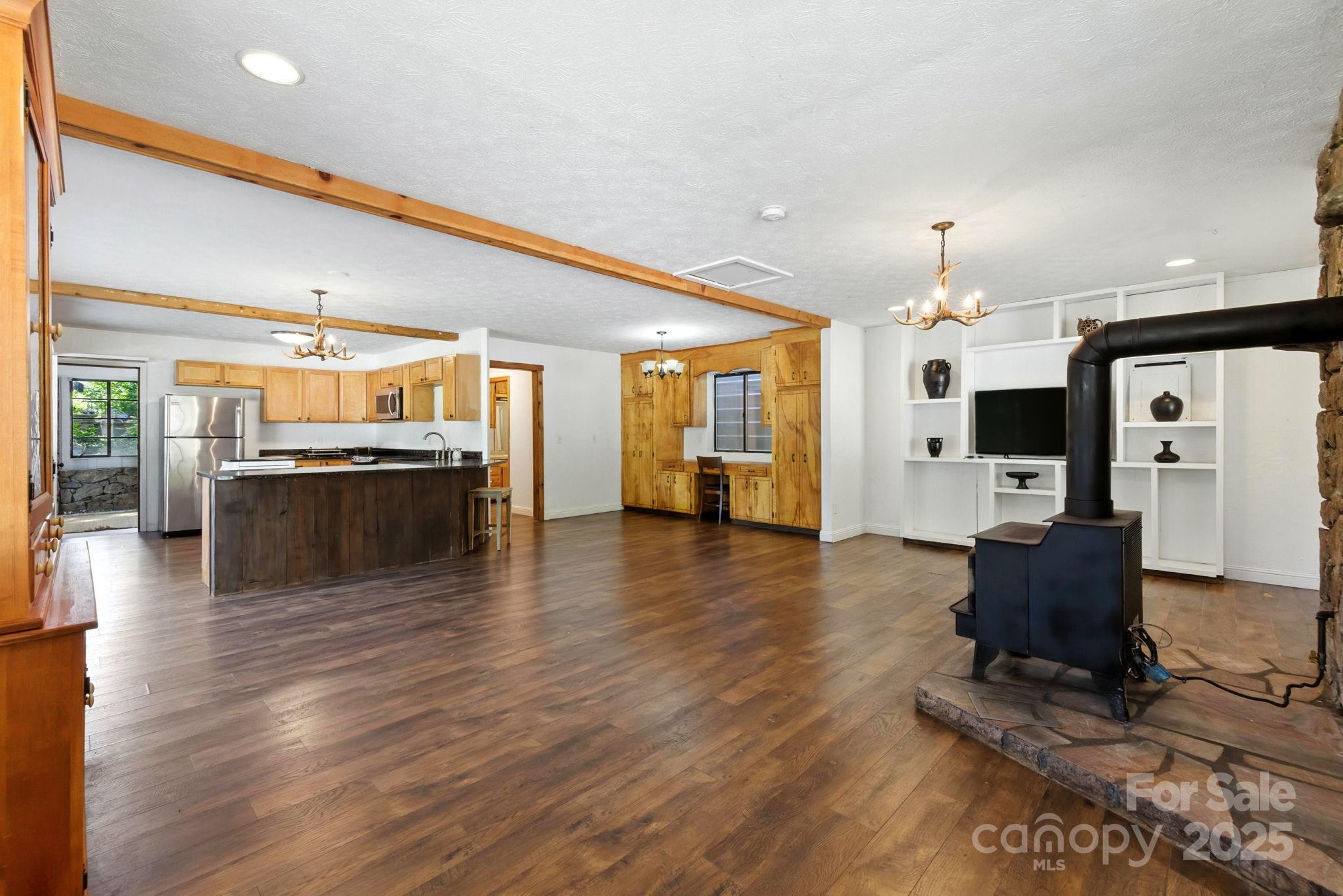 7741 Brevard Road Etowah, NC 28729 - Photo 39 of 48 a living room with furniture and a flat screen tv