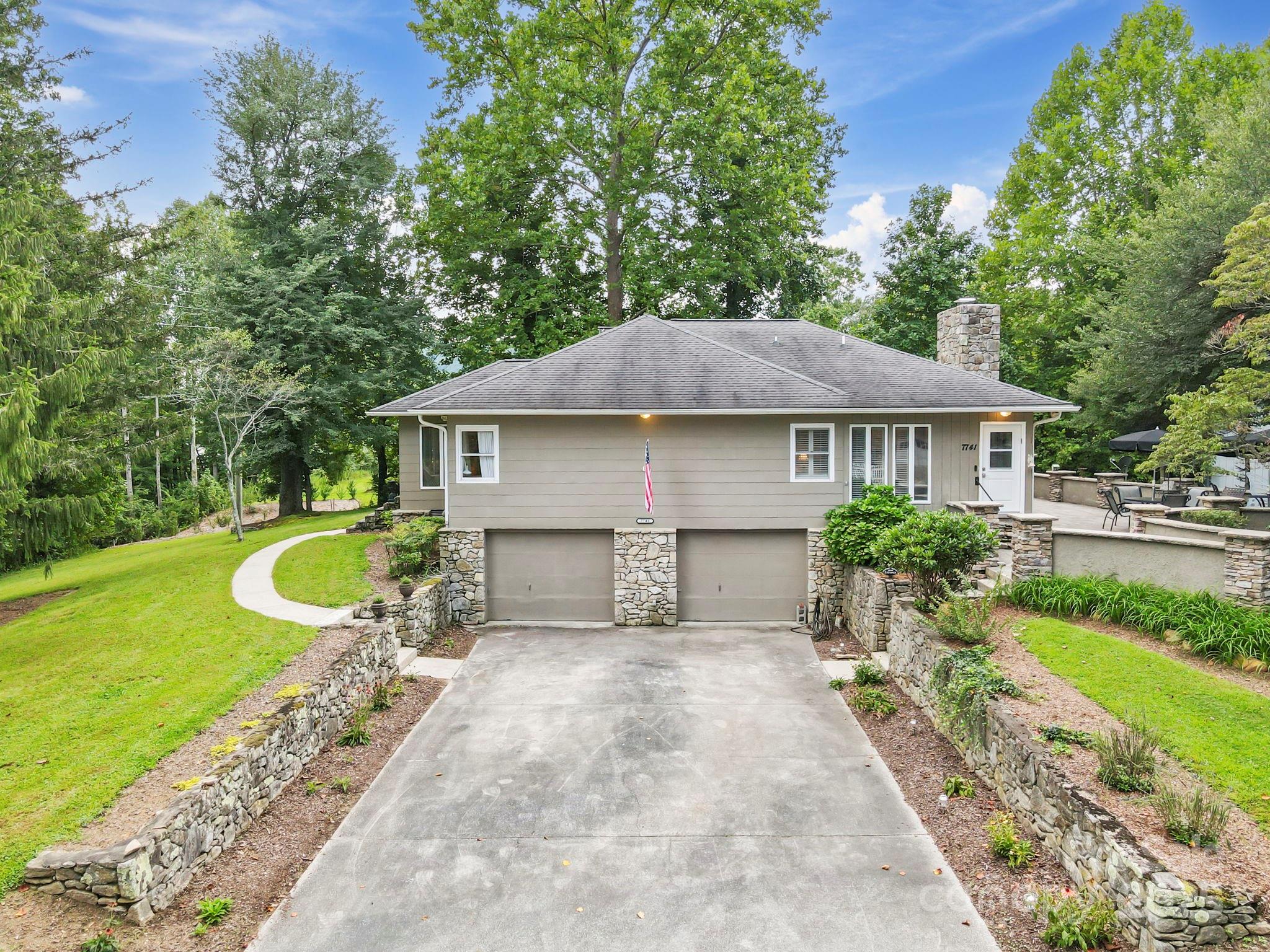 7741 Brevard Road Etowah, NC 28729 - Photo 4 of 48 a house view with a garden space