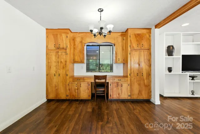 a kitchen with stainless steel appliances granite countertop a stove and cabinets
