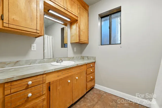 a bathroom with a toilet and a sink