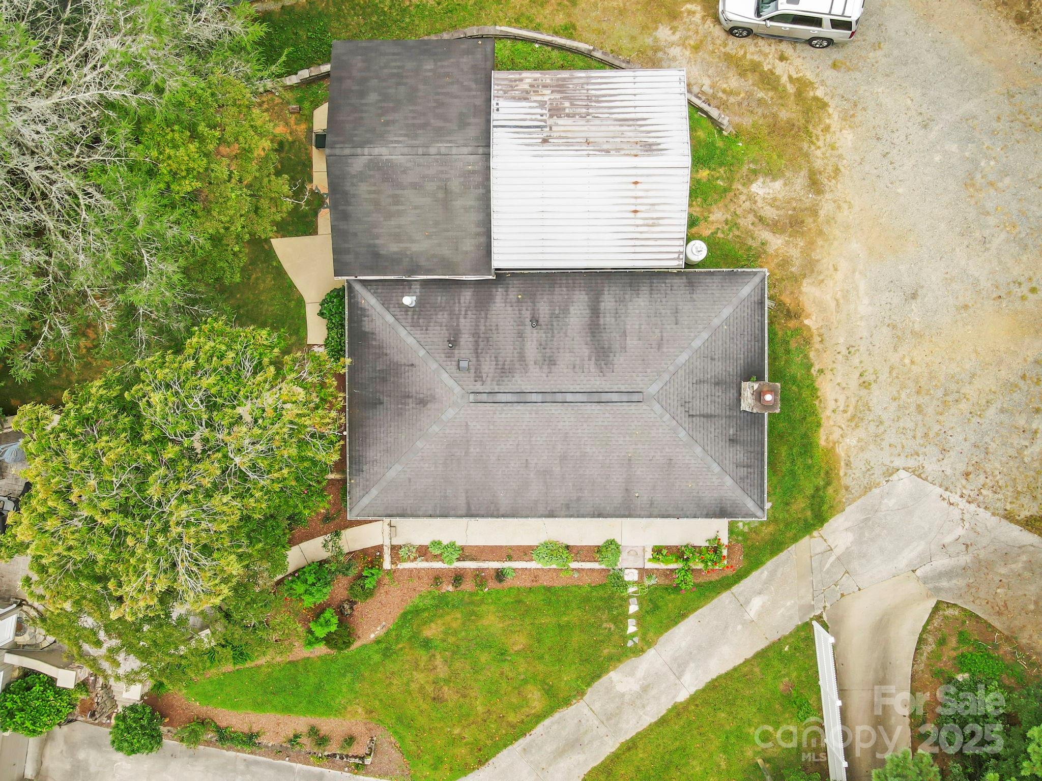 7741 Brevard Road Etowah, NC 28729 - Photo 10 of 48 a view of a yard with large tree