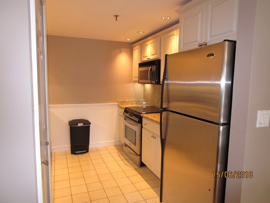 390 Commonwealth Avenue, Unit 210 Boston, MA 02215 - Photo 12 of 30 a metallic refrigerator freezer sitting in a kitchen