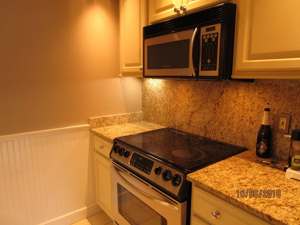 390 Commonwealth Avenue, Unit 210 Boston, MA 02215 - Photo 16 of 30 a kitchen with a stove and a microwave